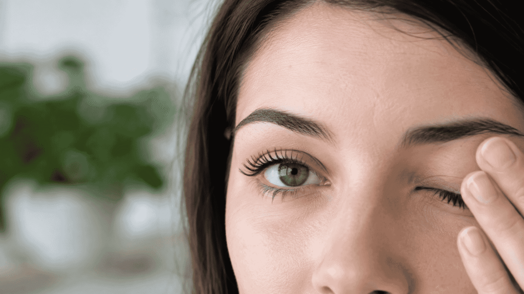 Close-up of a person blinking one eye